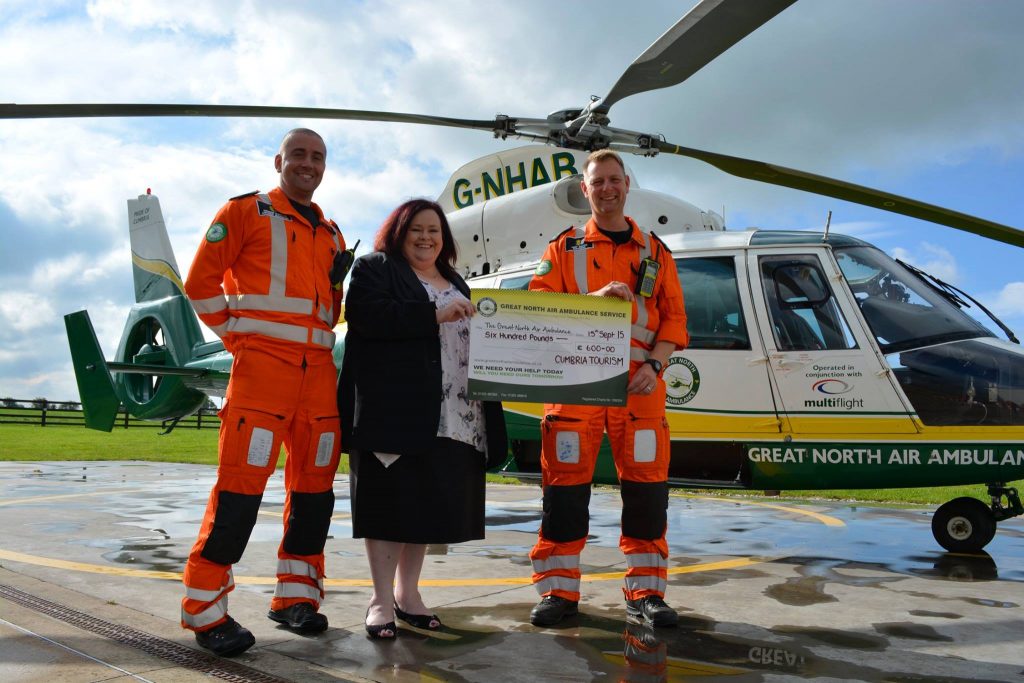 gnaas cheque presentation with corporate partner cumbria tourism